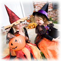 two girls in witch costumes